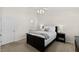 Bedroom with a bed, carpet, ceiling fan, and natural lighting from the windows at 7613 Satinwing Ln, Raleigh, NC 27617