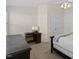 Neutral bedroom featuring plush carpet, dark furniture and white ceiling fan at 7613 Satinwing Ln, Raleigh, NC 27617
