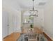 Charming dining area with a stylish rug and elegant chandelier at 7613 Satinwing Ln, Raleigh, NC 27617