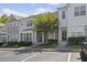 Charming townhome featuring a well-maintained facade, neatly landscaped front yard, and convenient parking at 7613 Satinwing Ln, Raleigh, NC 27617