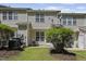 A backyard view of a home featuring a well-maintained lawn and a cozy patio area at 7613 Satinwing Ln, Raleigh, NC 27617