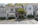 Charming townhome featuring a well-maintained facade with ample parking at 7613 Satinwing Ln, Raleigh, NC 27617