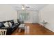 Open-concept living room featuring hardwood floors and neutral decor at 7613 Satinwing Ln, Raleigh, NC 27617