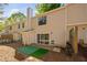 Townhouse backyard with sliding glass doors, partial fence and a single chair at 7707 Falcon Rest Cir, Raleigh, NC 27615