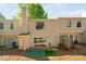 Townhouse backyard with sliding glass doors, small porch and partial fence at 7707 Falcon Rest Cir, Raleigh, NC 27615