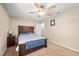 Bedroom featuring a queen-sized bed, ceiling fan, and nightstand at 7707 Falcon Rest Cir, Raleigh, NC 27615