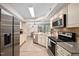 Well-equipped kitchen with granite countertops, stainless steel appliances, and modern cabinetry at 7707 Falcon Rest Cir, Raleigh, NC 27615