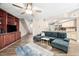 Bright, open-concept living space with hardwood floors, fireplace, and kitchen access at 7707 Falcon Rest Cir, Raleigh, NC 27615