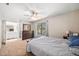 Comfortable main bedroom with a ceiling fan, window, and ensuite bathroom at 7707 Falcon Rest Cir, Raleigh, NC 27615