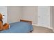 Bedroom featuring neutral walls, carpet flooring, and white double doors at 8309 Nantahala Dr, Raleigh, NC 27612
