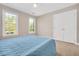 Bedroom featuring natural light, neutral walls, carpet flooring, and double closet at 8309 Nantahala Dr, Raleigh, NC 27612