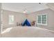Spacious bonus room with carpet flooring, dormer windows and ceiling fan at 8309 Nantahala Dr, Raleigh, NC 27612