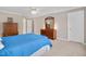 Comfortable bedroom features neutral walls, carpet, and wooden dressers with ample closet space at 8309 Nantahala Dr, Raleigh, NC 27612