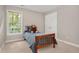 Cozy bedroom with a single bed, window, and a plush teddy bear accent at 8309 Nantahala Dr, Raleigh, NC 27612