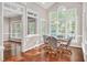 Bright breakfast nook with skylights and expansive windows, creating a tranquil dining atmosphere at 8309 Nantahala Dr, Raleigh, NC 27612