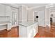 Kitchen boasts an island, granite counters and a work space perfect for remote work or homework at 8309 Nantahala Dr, Raleigh, NC 27612
