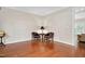 Cozy sitting area with hardwood floors, lamp, and comfortable leather chairs at 8309 Nantahala Dr, Raleigh, NC 27612