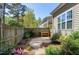The backyard features a stone path, a small wooden work bench, and a wooden fence at 837 Varina Ln, Fuquay Varina, NC 27526