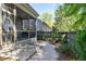 Stone pathway, wooden fence, and screened porch can be seen in the backyard at 837 Varina Ln, Fuquay Varina, NC 27526
