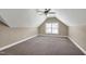 Attic bedroom with carpet, window, and angled ceiling at 837 Varina Ln, Fuquay Varina, NC 27526