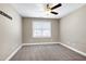 Bedroom with neutral walls, carpet, and a window at 837 Varina Ln, Fuquay Varina, NC 27526
