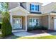 Charming brick home with a light blue front door, complemented by a well-manicured lawn at 837 Varina Ln, Fuquay Varina, NC 27526