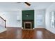 Bright living room features a fireplace, hardwood floors, and neutral paint at 837 Varina Ln, Fuquay Varina, NC 27526