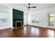Bright living room with fireplace and hardwood floors opens to a back door at 837 Varina Ln, Fuquay Varina, NC 27526