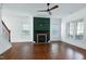 Bright living room features a fireplace, hardwood floors, and neutral paint at 837 Varina Ln, Fuquay Varina, NC 27526