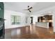 Bright living room showing hardwood floors opens to kitchen area with island at 837 Varina Ln, Fuquay Varina, NC 27526