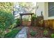 Stone pathway leading to wooden gate and landscaped features at 906 Ingram Ct, Hillsborough, NC 27278