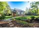 A scenic landscaped backyard with a stone pathway at 906 Ingram Ct, Hillsborough, NC 27278