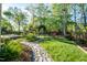 This home has a well-manicured lawn, stone walking path and landscape at 906 Ingram Ct, Hillsborough, NC 27278