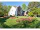 Well manicured front yard with mature landscaping at 906 Ingram Ct, Hillsborough, NC 27278