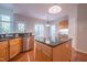 Kitchen boasting granite countertops, stainless steel appliances, and a center island at 906 Ingram Ct, Hillsborough, NC 27278