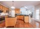 Well-lit kitchen with stainless steel appliances, granite countertops, and ample cabinet space at 906 Ingram Ct, Hillsborough, NC 27278