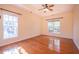 Bedroom featuring hardwood floors, neutral walls, and abundant natural light at 906 Ingram Ct, Hillsborough, NC 27278