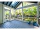 Screened in porch with a ceiling fan and a lovely view at 906 Ingram Ct, Hillsborough, NC 27278