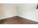 This bedroom features hardwood floors and neutral paint at 9225 Palm Bay Cir, Raleigh, NC 27617