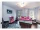 Bedroom with hardwood floors, neutral walls, ceiling fan, and great natural light at 9225 Palm Bay Cir, Raleigh, NC 27617