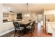 Dining area featuring modern table with chairs and open layout to adjacent rooms at 9225 Palm Bay Cir, Raleigh, NC 27617