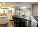 Dining area featuring modern table with chairs and skylight offering natural light at 9225 Palm Bay Cir, Raleigh, NC 27617