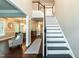 Beautiful entryway with hardwood floors, staircase, and views into the living and dining rooms at 9225 Palm Bay Cir, Raleigh, NC 27617