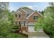 Charming brick two-story home featuring an attached two-car garage and manicured landscaping at 9225 Palm Bay Cir, Raleigh, NC 27617