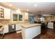 Bright kitchen with an island, white cabinets, and stainless steel appliances at 9225 Palm Bay Cir, Raleigh, NC 27617