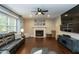 Comfortable living room with plush seating, fireplace, and large window at 9225 Palm Bay Cir, Raleigh, NC 27617