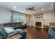 Comfortable living room with plush seating, fireplace, and large window at 9225 Palm Bay Cir, Raleigh, NC 27617