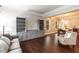 Spacious living room with hardwood floors, built-in cabinets, and a cozy seating area at 9225 Palm Bay Cir, Raleigh, NC 27617