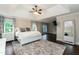 Spacious main bedroom with tray ceiling, natural light, and sitting area at 9225 Palm Bay Cir, Raleigh, NC 27617