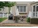 Outdoor patio with dining set, grill, and manicured landscaping, perfect for entertaining guests at 9225 Palm Bay Cir, Raleigh, NC 27617